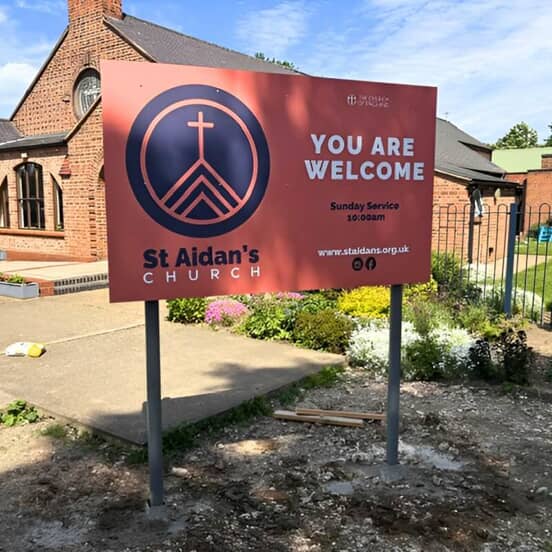 An image of the "You are Welcome" post and panel Church sign outside.